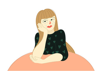 a young girl sits at a table and cries in frustrated feelings