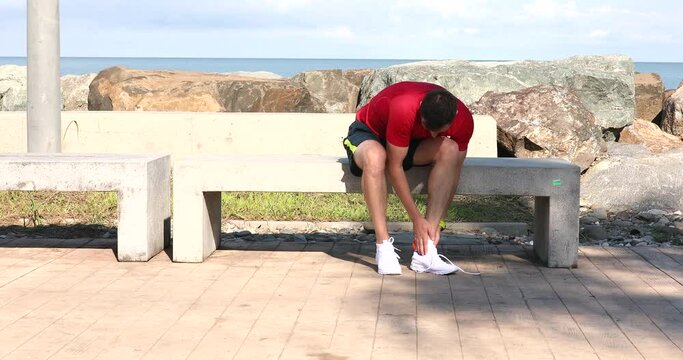 Sports injury. Man with pain in ankle while jogging