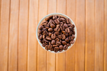 Coffee beans in a transparent glass glass. The smell of coffee. 