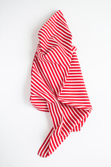 Top view of striped napkin on the black background. Close-up. Abstract background.