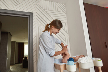 Baby massage with special sensitive skin care cosmetics