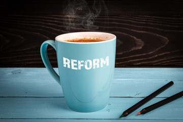 Reform. Health, education and business concept. Coffee mug on the table