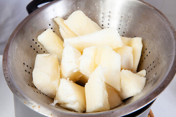 Preparation of a traditional Colombian fried  stuffed yucca dumplings called carimañolas