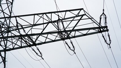 Power line from high voltage line under cloudy sky