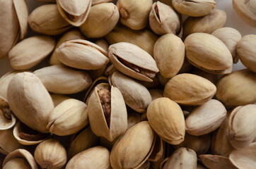 close-up of fried salted pistachios on the table. 