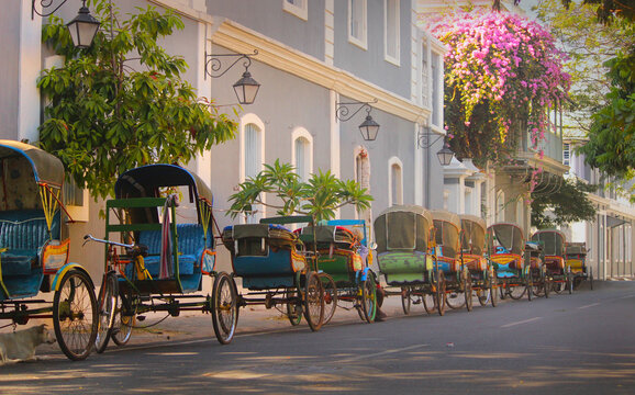 Vintage tricycle carts on French style street at a union territory on south India. Rickshaws on Puducherry street. 