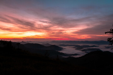 sunrise in a cold pasture red sky and beautiful clouds