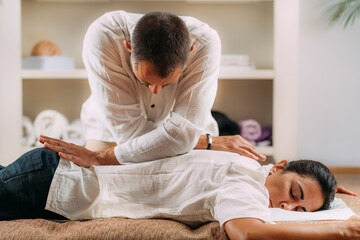 Woman Getting Shiatsu Back Massage. - obrazy, fototapety, plakaty