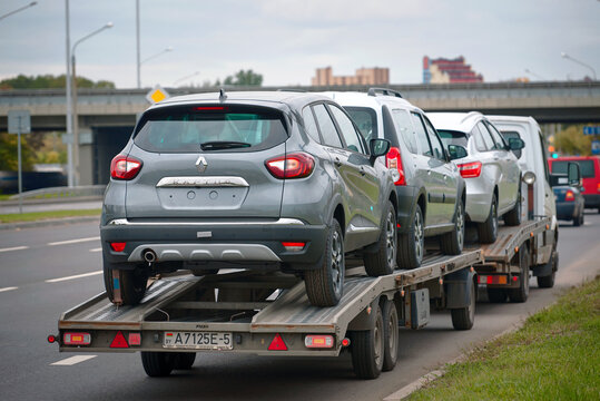 Minsk, Belarus. Sep 2021. Car transporter deliver new Renault cars to dealership. Car carrier with new Renault Kaptur cars. New cars transportation.