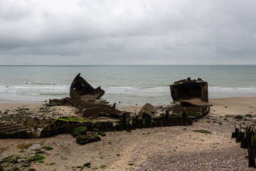 Fototapeta na wymiar Industrial beach between Le Havre and Etretat on a rainy day in France, Europe 