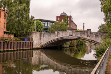 Fototapeta na wymiar Norwich, Norfolk, UK – September 11 2021. White Friar’s bridge over the River Wensum in the city centre
