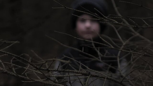 The little boy is lost in a dark forest. Cinematic Halloween film