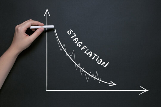 chalk drawing of falling GDP, recession in economic growth with high inflation, stagflation concept