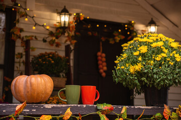 Cozy autumn concept with pumpkins and cup of coffee outdoor

