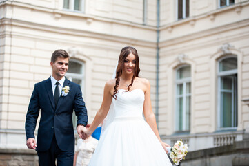 Naklejka premium Happy bride and groom after wedding ceremony