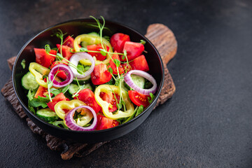 vegetable salad fresh tomato, cucumber, pepper, onion, olive oil healthy veggie meal snack on the table copy space food background rustic keto or paleo diet vegan