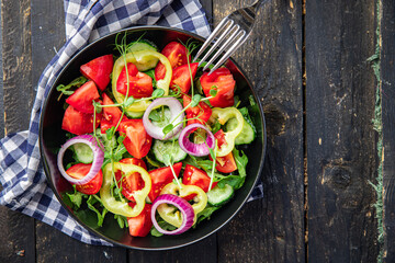 vegetable salad fresh tomato, cucumber, pepper, onion, olive oil healthy veggie meal snack on the table copy space food background rustic keto or paleo diet vegan