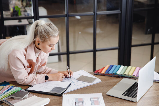 Happy Woman Creative Interior Designer Working At Office Workplace With Laptop.Online Consultation With Client Through Video Call