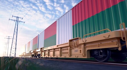 Fototapeta premium Madagascarians exports. Freight train with loaded containers in motion. 