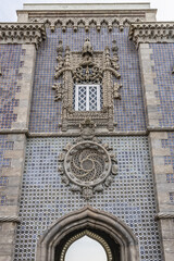 Architectural fragment of Pena Palace - Romanticist palace in Sao Pedro de Penaferrim. Sintra, Portugal. Pena Palace - and one of Seven Wonders of Portugal.