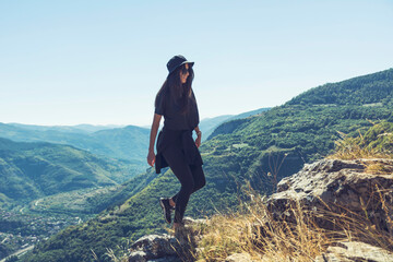 Young woman with hat hiking in the beautiful high mountain .Bov Village, Balkan Mountain, Iskar Gorge