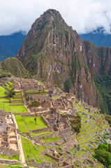 Machu Picchu inca ruins in vertical format, Cusco, Peru, South America.