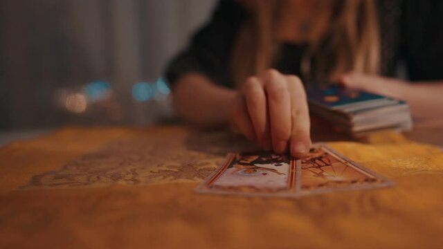 Fortune teller female hands and tarot cards
