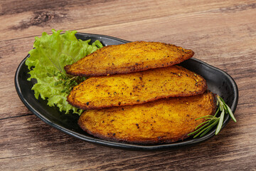 Baked potato with herbs and spices