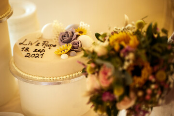 a variety of cakes and desserts in a glass case