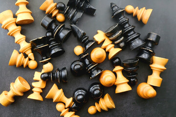 Vintage wooden chess pieces on dark background. Flat lay.