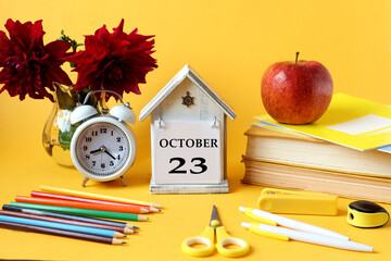 Calendar for October 23 : decorative house with the name of the month in English and the number 23,...