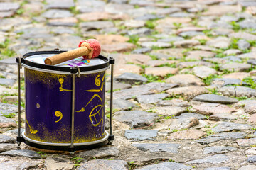 Small drum decorated on the cobblestones of the Pelourinho slopes in Salvador, Bahia