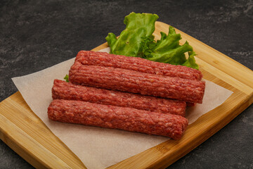 Raw beef sausages with spices