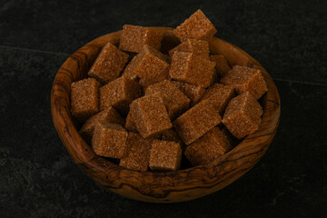 Cane sugar cubs in the bowl
