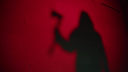 Creepy death silhouette walking with axe on red background. Mystical scary murderer going to kill. Halloween costume of killer. Horror scene movie of psycho serial. 