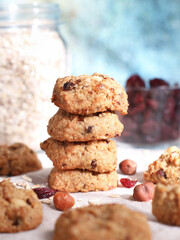 Close up of healthy oatmeal cookies with dried cranberries and hazelnut, an idea for diet people as its have a lower glycemic index than other cookies