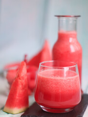 A glass of fresh and healthy watermelon and its sliced. A idea for hydration during summer as well as for dieting. 