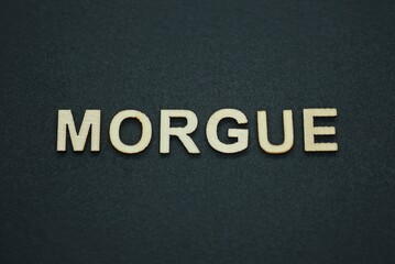 text on word morgue from gray wooden letters on a black backgroun