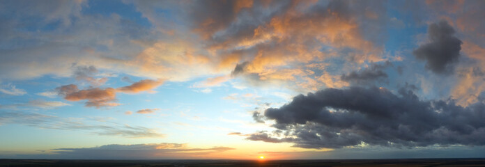Dawn sky, sunbeams and dreams, morning panorama.