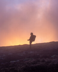 A photographer in sunset in Low Tatras mountains national park, Slovakia