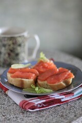 Closeup sandwich with salmon appetizer sea food delicious hand food eat dinner lunch nobody kitchen cooking cafe bread fresh healthy tasty
