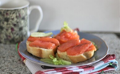 Closeup sandwich with salmon appetizer sea food delicious hand food eat dinner lunch nobody kitchen cooking cafe bread fresh healthy