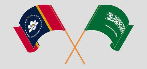 Crossed and waving flags of The State of Mississippi and the Kingdom of Saudi Arabia