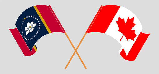 Crossed and waving flags of The State of Mississippi and Canada