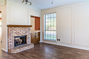 Empty living room in a private residence with a fire place