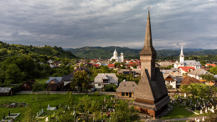 Fototapeta na wymiar Aerial view of wooden churches from Maramures national park in Romania