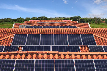 Solar panels Instalation on the roof of many houses in a sunny and cloudy day. Photovoltaic Solar...