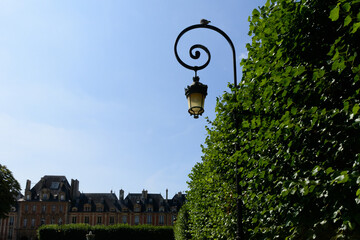 old urban lantern Vosges Square in Paris France one of the most beautiful and tourist squares