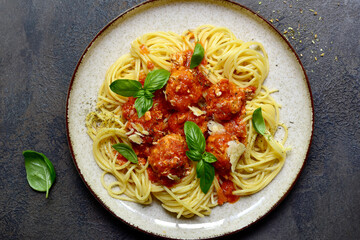 Pasta spaghetti with meat ball in tomato sauce. Top view with copy space.