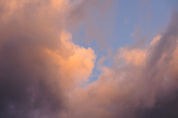 Large orange-pink clouds in a blue sky